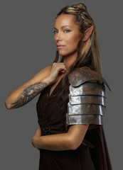 Beautiful elf woman on grey background