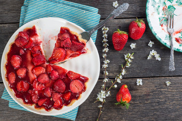 Wall Mural - serving homemade strawberry cake or pie on wooden table