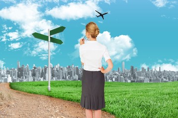 Poster - Composite image of thinking businesswoman