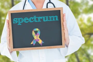 Poster - Spectrum against low angle view of tall trees