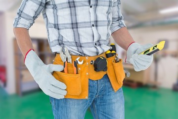 Poster - technician holding spirit level over white background