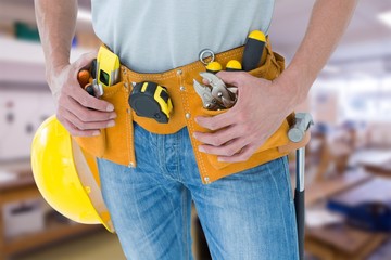 Poster - Composite image of technician with tool belt around waist