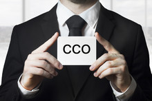 Businessman Holding Small White Sign Cco