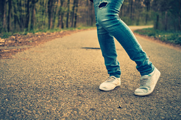 Wall Mural - woman jeans and sneaker shoes