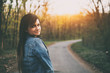 © Creaturart - Young brunette caucasian woman look back on the road