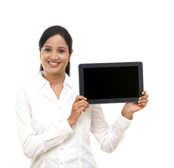 Wall Mural - Young business woman showing tablet computer against white