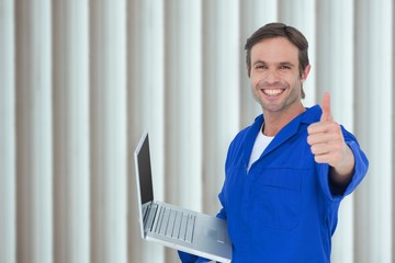 Poster - mechanic holding laptop while showing thumbs up