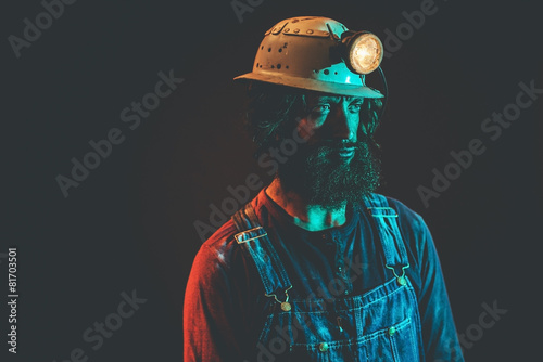 Male Miner Wearing Helmet Lamp Staring to the Side Stock Photo | Adobe