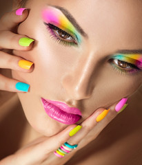 Poster - beauty girl face with vivid makeup and colorful nail polish