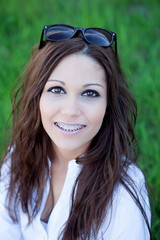 Wall Mural - Brunette cool girl with brackets outside