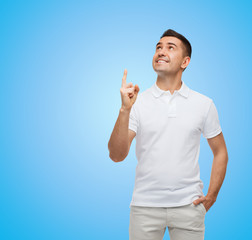 Poster - smiling man pointing finger up