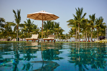 Canvas Print - Luxury swimming pool a tropical resort