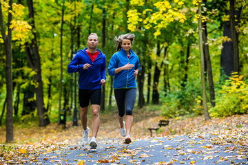 Wall Mural - Healthy lifestyle - woman and man running