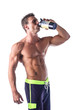 © theartofphoto - Muscular shirtless male bodybuilder holding protein shake bottle