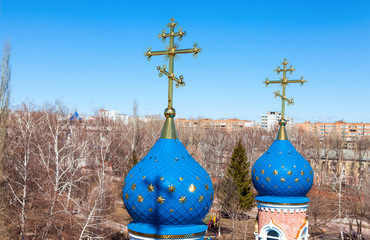 Canvas Print - Domes of Russian orthodox church with cross against blue sky