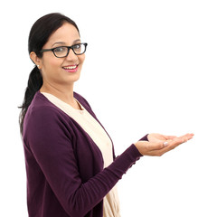 Wall Mural - Young woman holding her hand showing something on the open palm