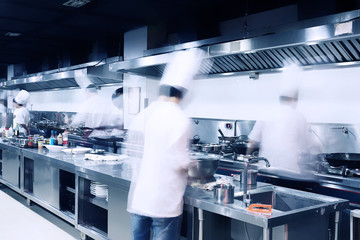 Wall Mural - modern hotel kitchen and busy chefs.