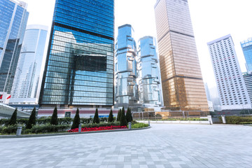 Wall Mural - empty pavement and skyscrapers in modern city