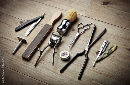 Poster Vintage tools of barber shop on wood desk