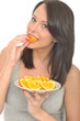 Attractive Young Woman Holding a Plate of Sliced Oranges