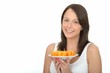 Healthy Young Woman Holding a Plate of Fresh Orange Segments