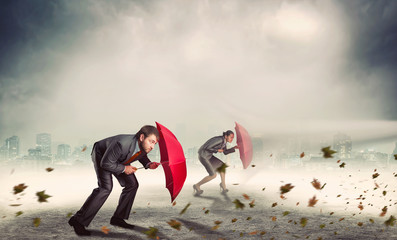 businessman and businesswoman in storm