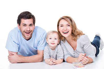 Sticker - Smiling young family with little child.