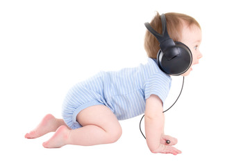 Wall Mural - side view of baby boy toddler with headphones isolated on white