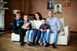 © cmirnovalexander - Portrait of happy multigenerational family in sitting room at home
