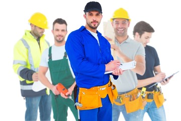 Poster - Composite image of handyman in blue overall writing on clipboard