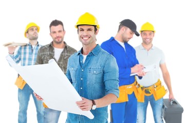 Poster - Composite image of happy architect holding blueprint in house