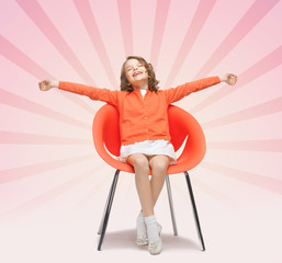 Poster - happy little girl sitting on designer chair