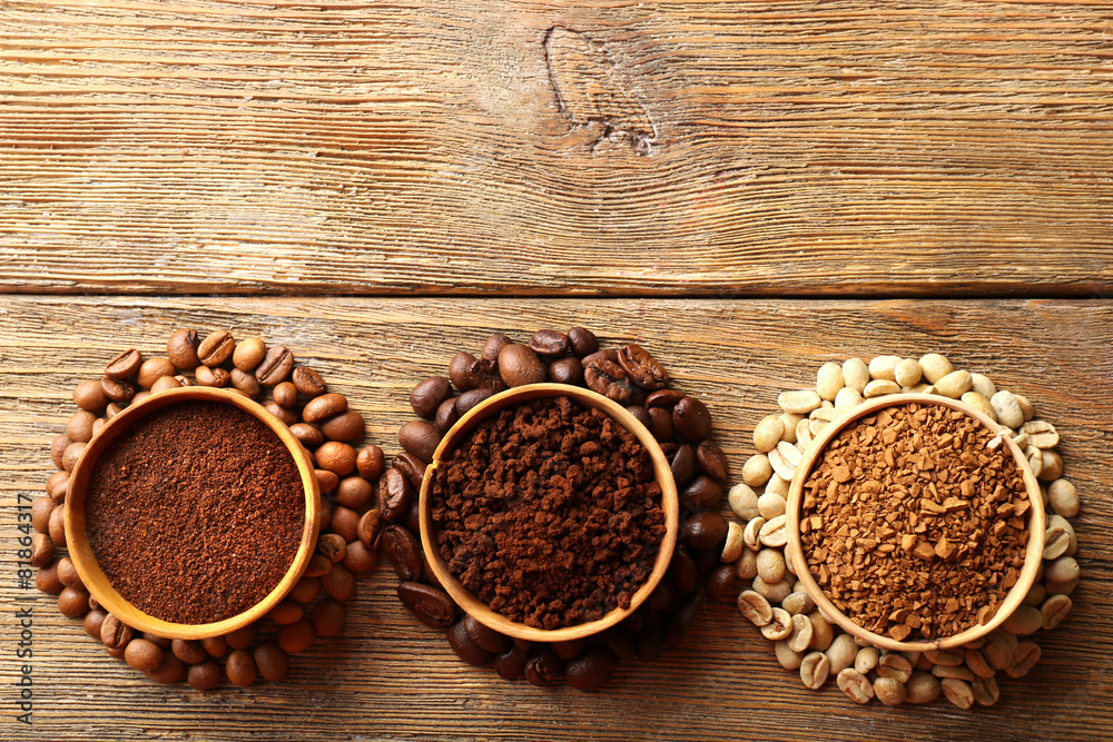 Various of coffee in small dishes on wooden table, top view