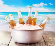 Cold Bottles Of Beer In Bucket With Ice
