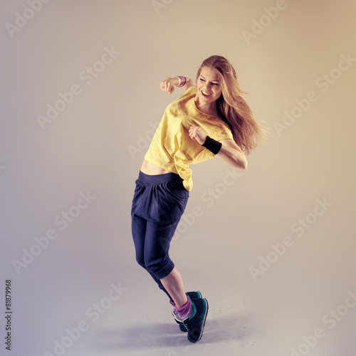 Vászonkép Young pretty Caucasian hip hop girl dancing with fun