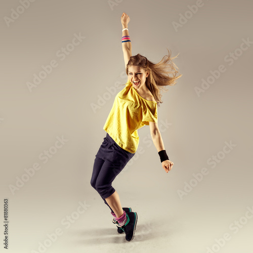 Zumba dance workout. Young sporty woman dancer in motion. Plakát