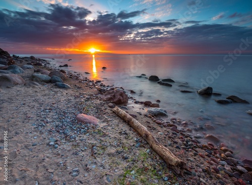 Fototapeta na wymiar Rocky sea shore at sunrise. Beautiful seascape