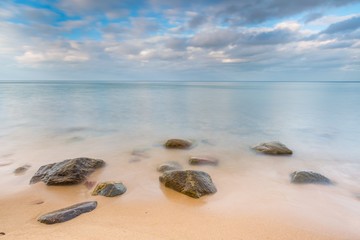 rocky sea shore at sunrise. beautiful seascape
