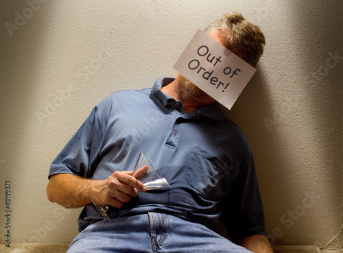 Fotografering Unconscious drunk man with Out of Order sign