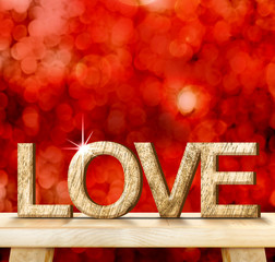 Poster - LOVE word in wood texture on wooden table with red bokeh backgro