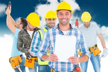 Poster - Portrait of smiling manual worker holding clipboard