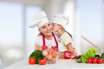 Canvas Print - Mother. Mother and daughter prepare salads