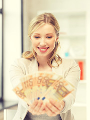 Wall Mural - lovely woman with euro cash money