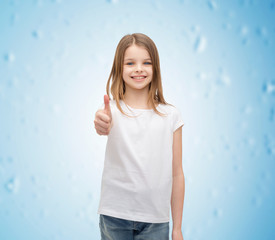 Wall Mural - girl in blank white t-shirt showing thumbs up