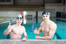 Professional Swimmers Gesturing Thumbs Up