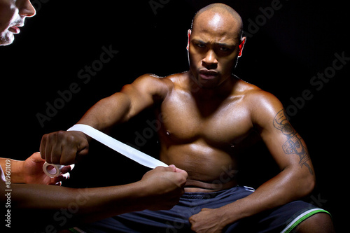 Fighter or Boxer with trainer applying athletic tape Fototapete