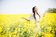 © BGStock72 - Young woman in the spring field