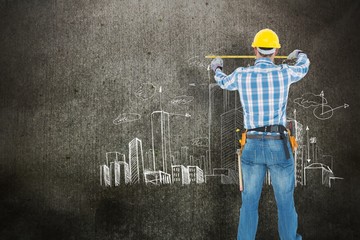 Poster - Construction worker using measure tape