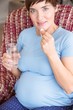 © WavebreakMediaMicro - Pregnant woman taking a vitamin tablet