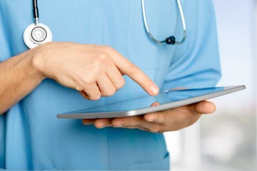 Wall Mural - Tablet. Hands of doctor using tablet computer